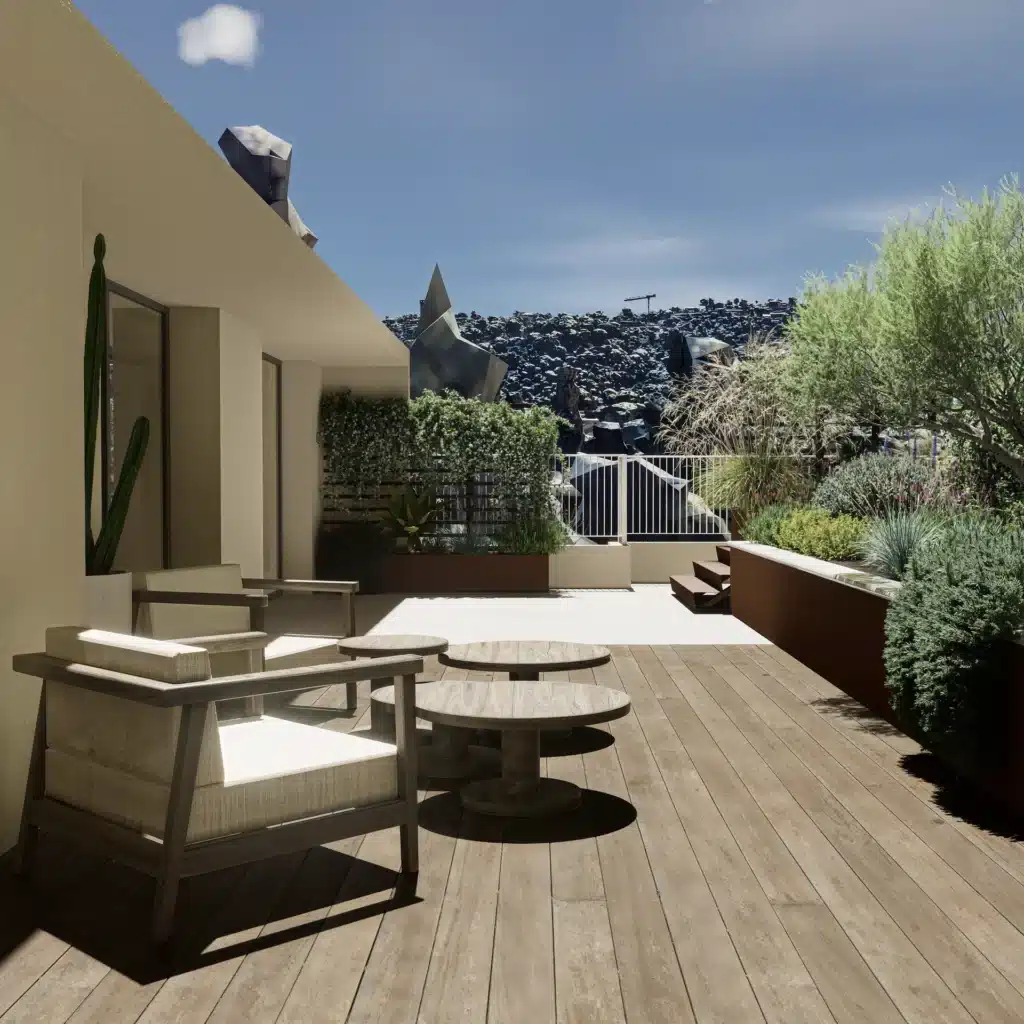 Terrasse moderne en bois et mobilier d'extérieur design Terrasse en bois avec mobilier design, jardin luxuriant et vue sur un paysage rocheux atypique.